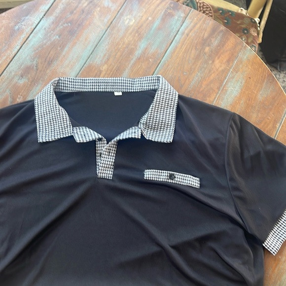 Black polo with checkered collar, pocket and sleeve cuff. No brand. New - Picture 1 of 1